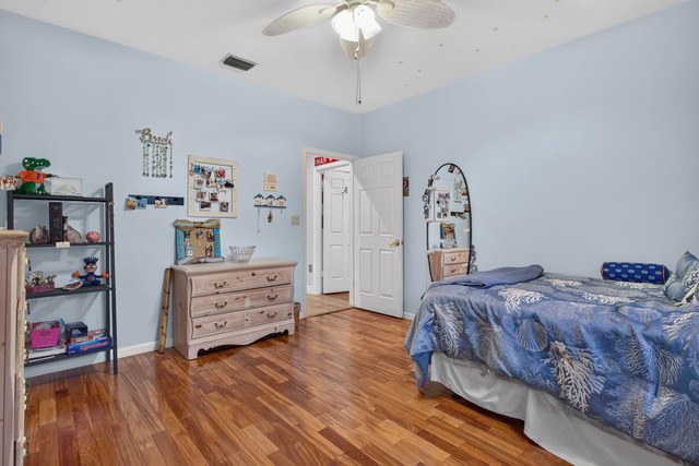 Bedroom with wood floors