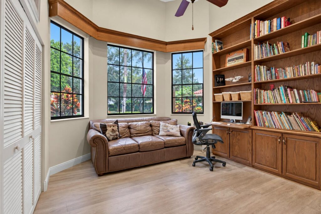 Fifth bedroom set up as a private office with built in bookshelves