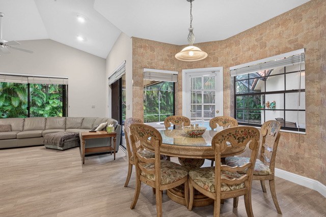 Breakfast area with bay windows looking toward the pool
