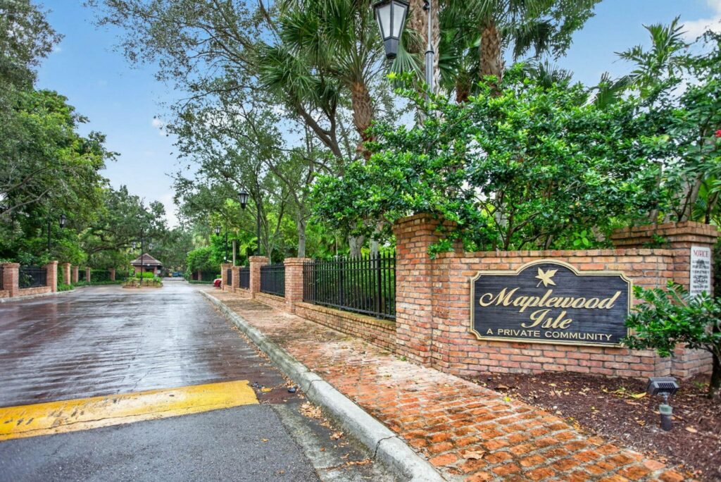 The Maplewood Isle entrance sign and brick gate posts