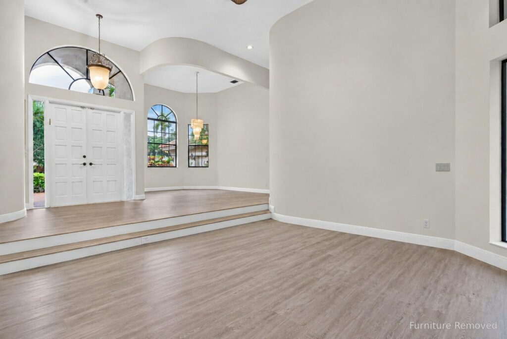 Entrance foyer with double front doors and an arched transom