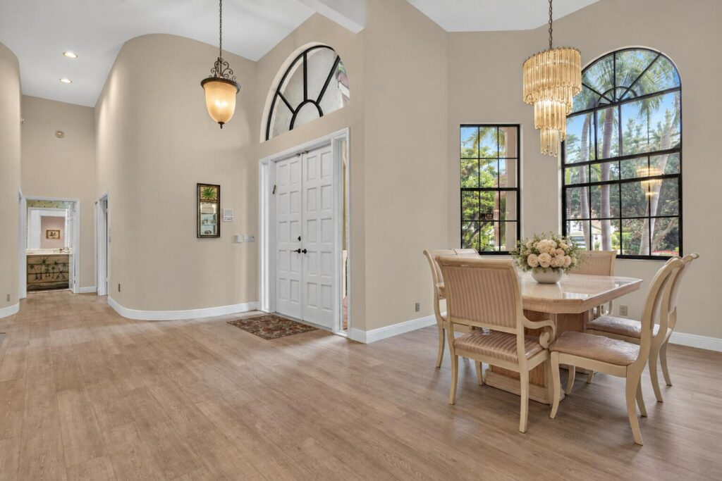 View from the foyer into the formal dining room with arched windows