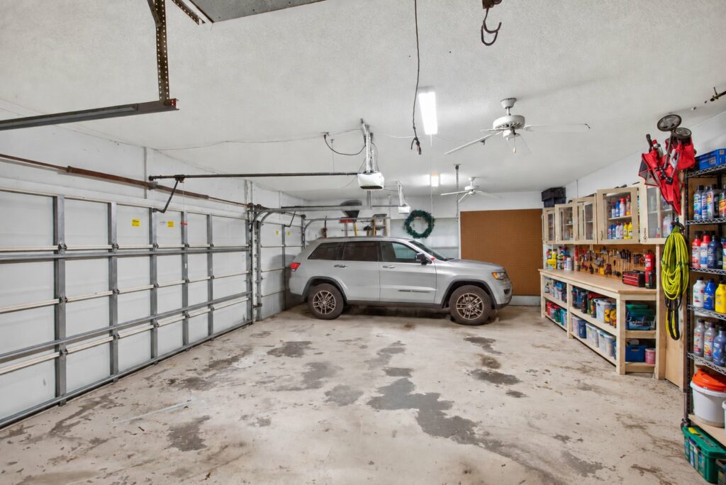 Garage with built in shelving and workbench storage