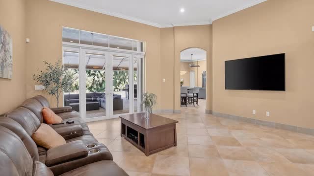 Living room with French doors opening to the covered patio